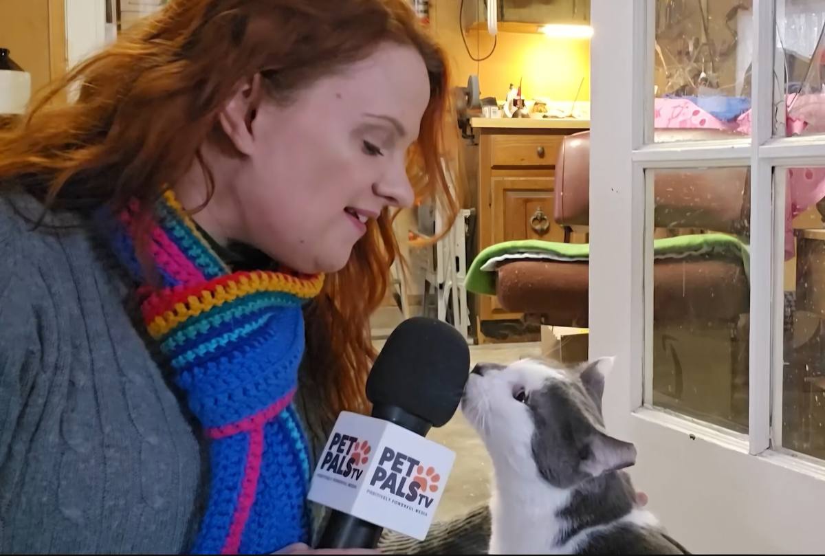 KJ with Pet Pals TV mic and a cat